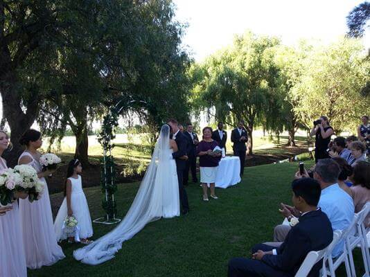 5708940_14_Joy-with-long-view-wedding-party-and-guests.jpg