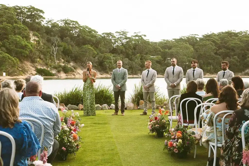 Ceremony-10 Jacqua Celebrant welcoming guests to a ceremony, standing by the groom and his groomsmen at The Cove Jervis Bay